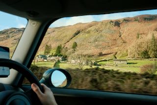 Picture of a house from a moving car